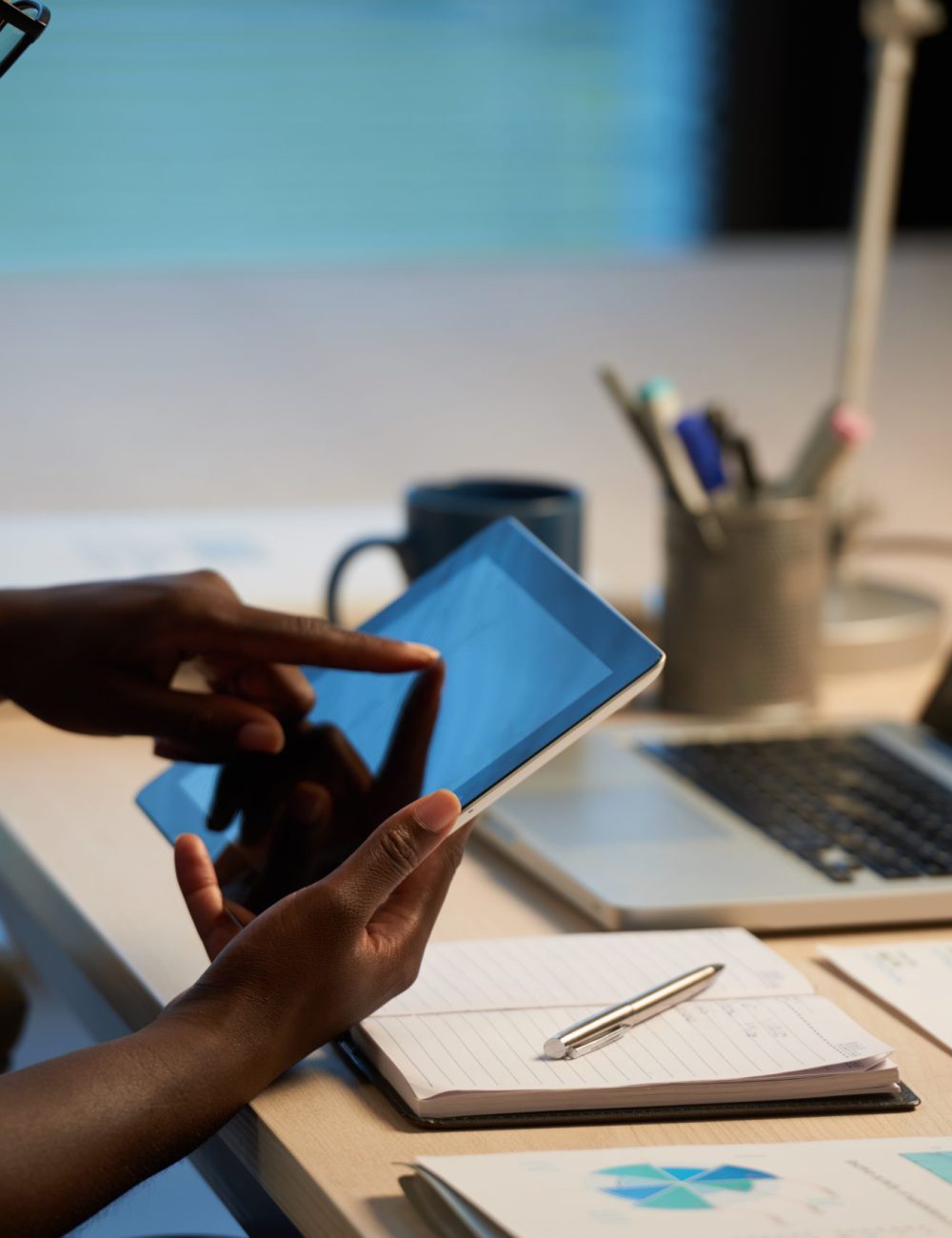 Business woman working in office Cropped image of business woman using app on her tablet